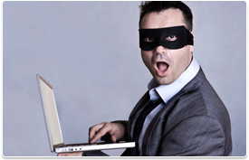 masked man on laptop