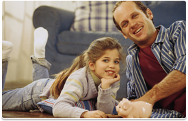 man with daughter and small piggy bank