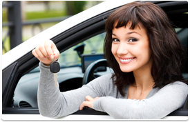 woman in car showing key